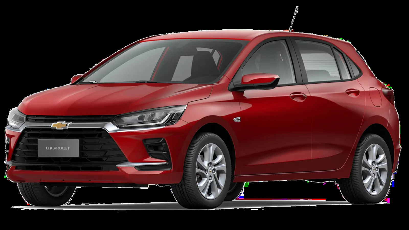 Chevrolet Onix vermelho RS hatch vista lateral em estrada movimentada