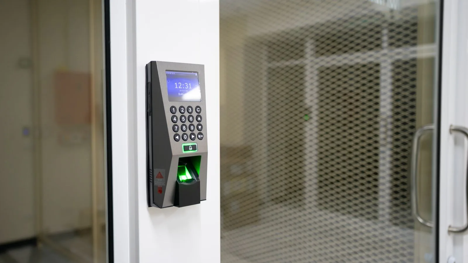 A modern fingerprint scanner for secure access control in an office environment.