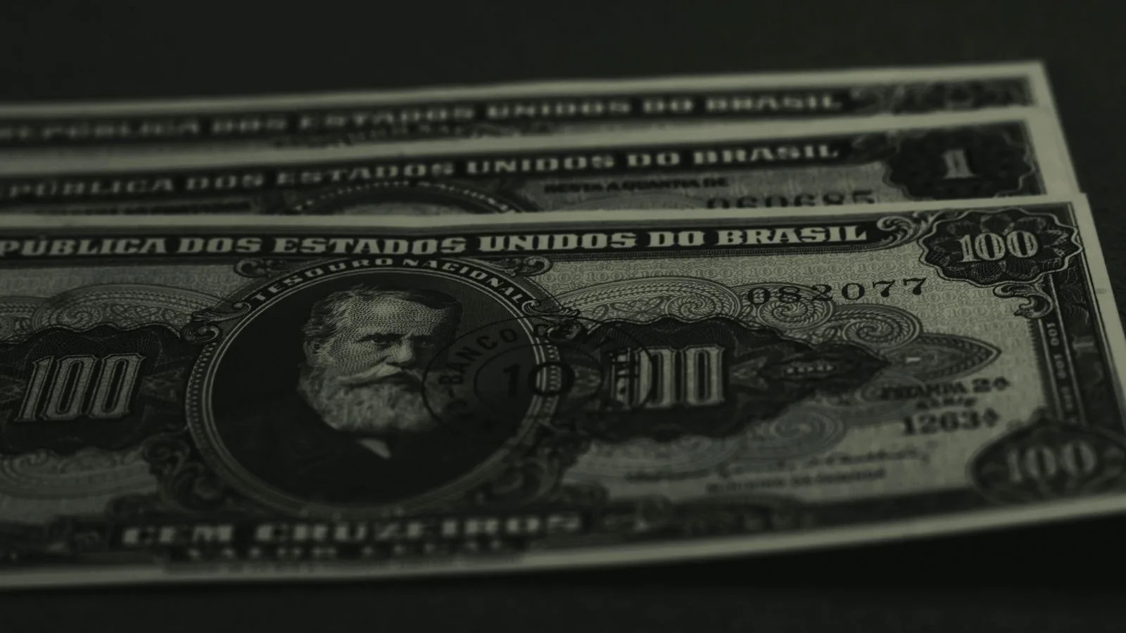 Close-up photo of vintage Brazilian banknotes showcasing historical currency design.