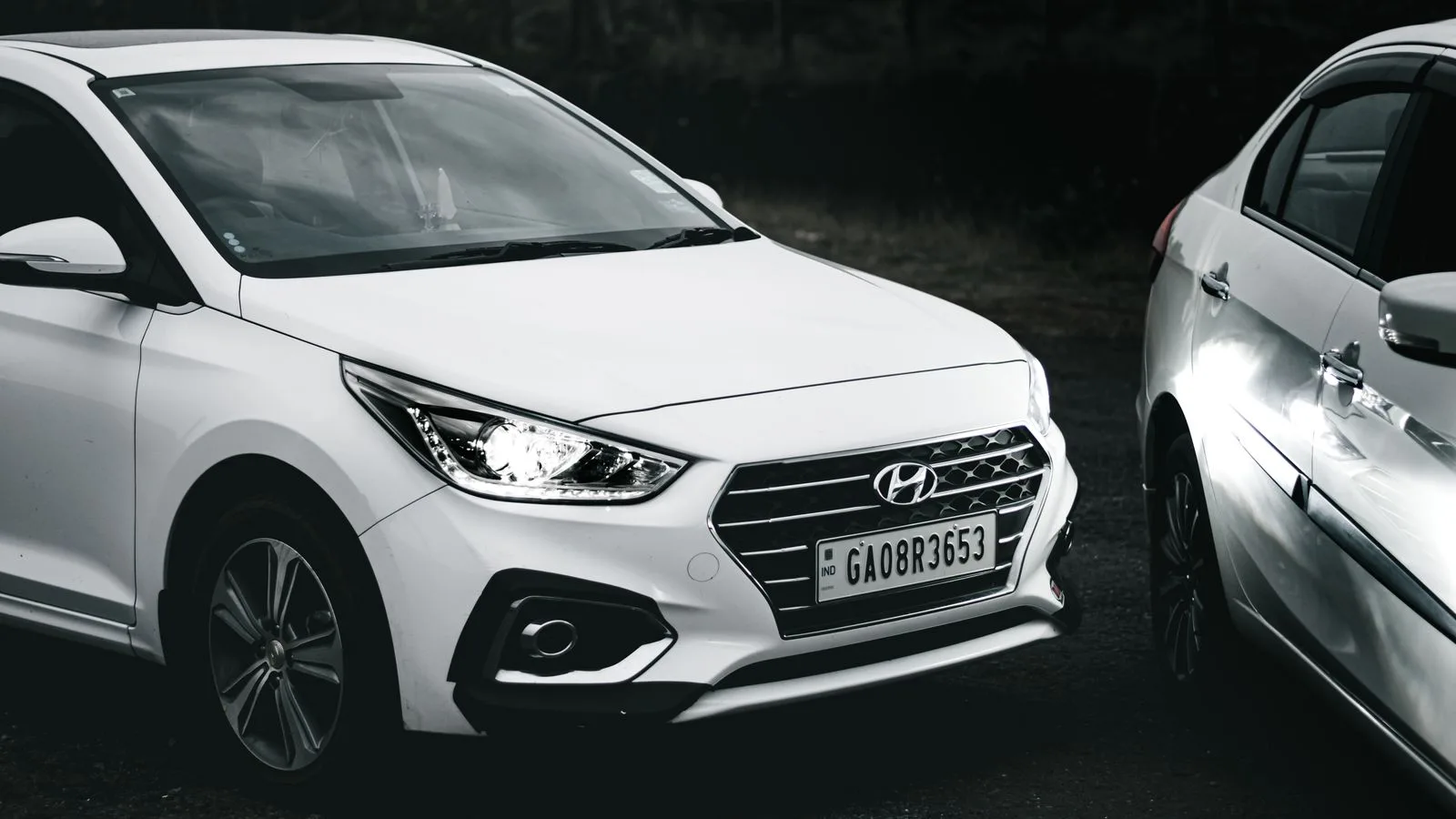 Monochrome image of a Hyundai car with visible license plate. Perfect for automotive themes.