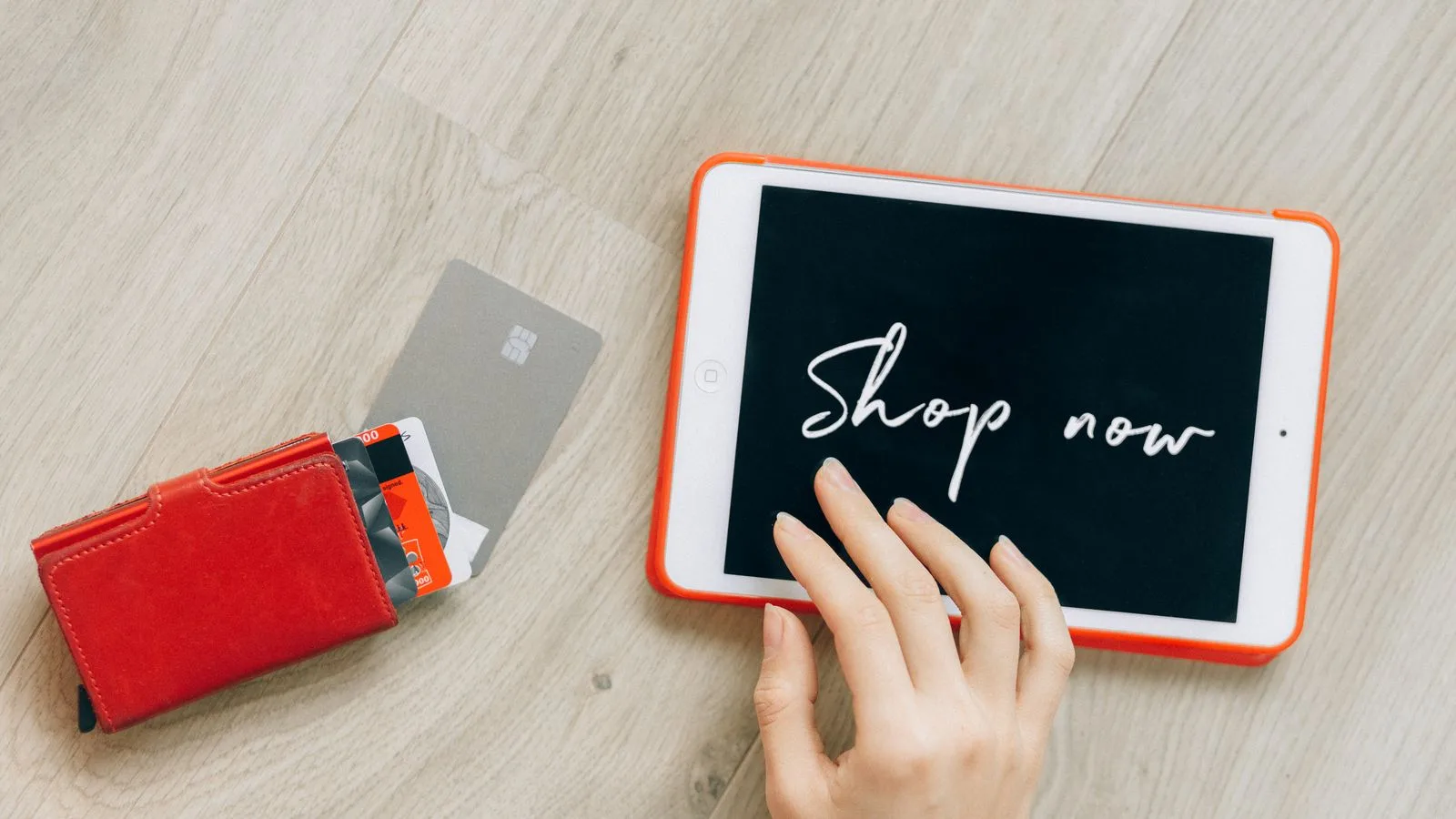 Close-up of a digital shopping theme with a tablet and credit cards, highlighting a modern retail experience.