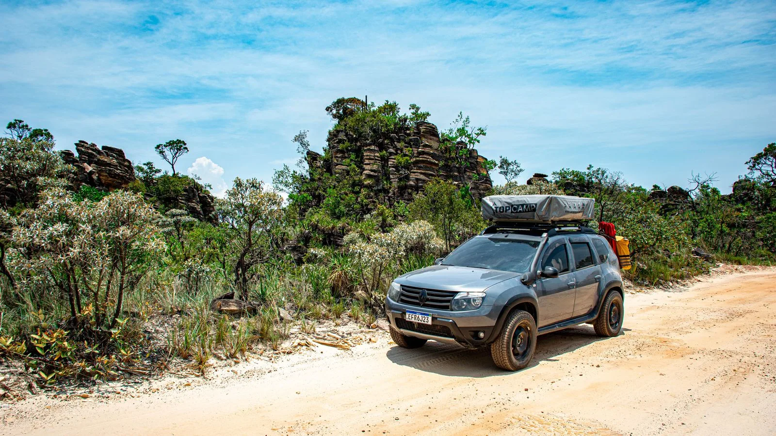 4x4 vehicle on a scenic dirt road in Serra da Canastra, Brazil, ideal for off-road adventures.